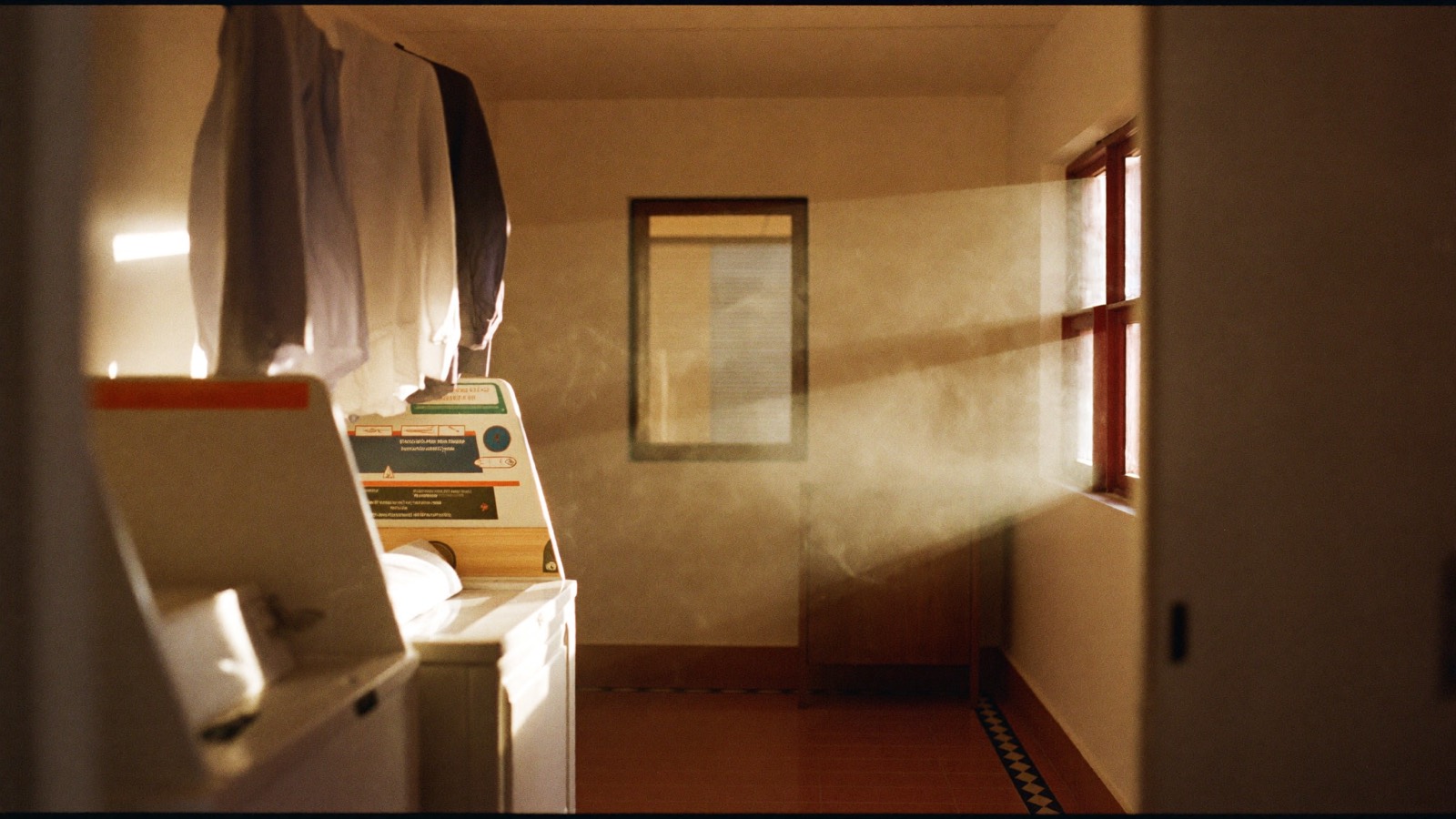 A tidy laundry at golden hour, shirts pressed and hung
